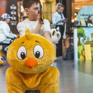 children with zoomzoo ridable toys
